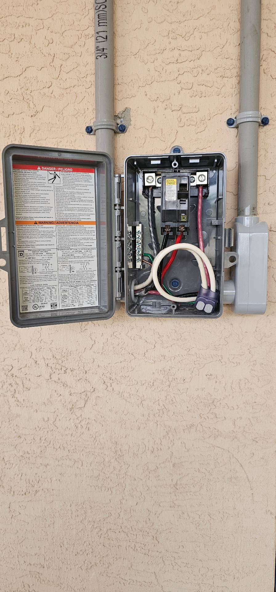 Newly installed exterior disconnect with conduit and breaker