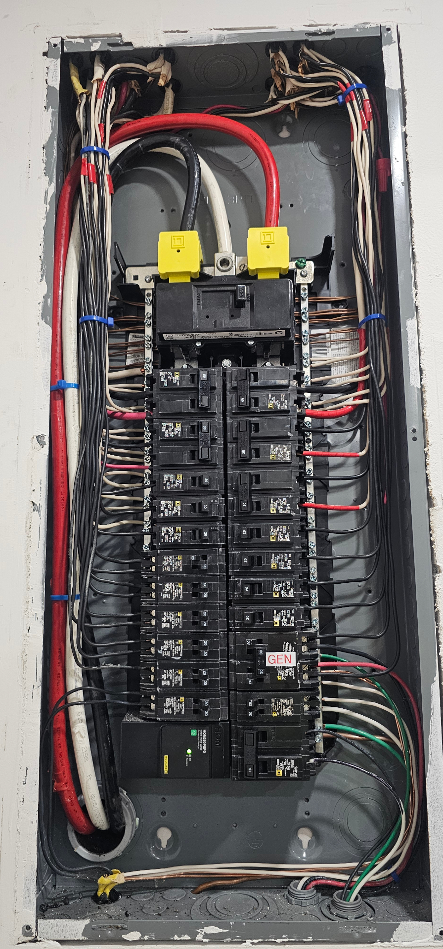 Indoor breaker panel with organized branch circuits and generator breaker