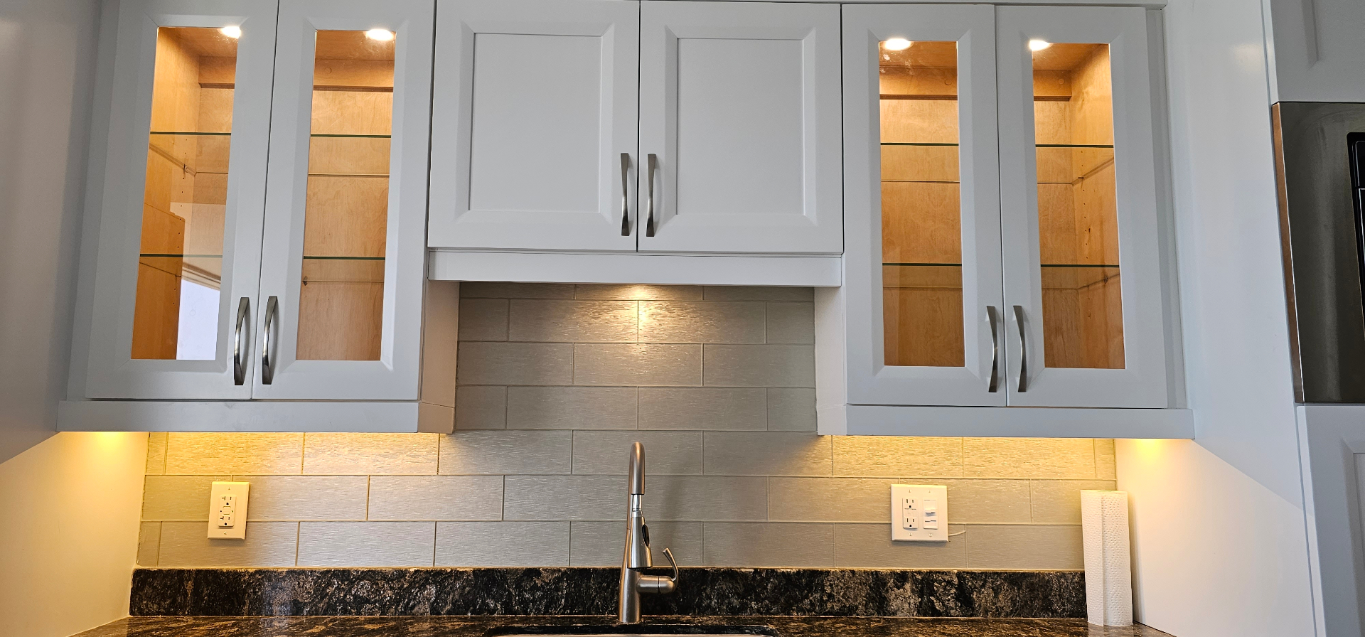 Kitchen with in-cabinet lighting and GFCI outlets