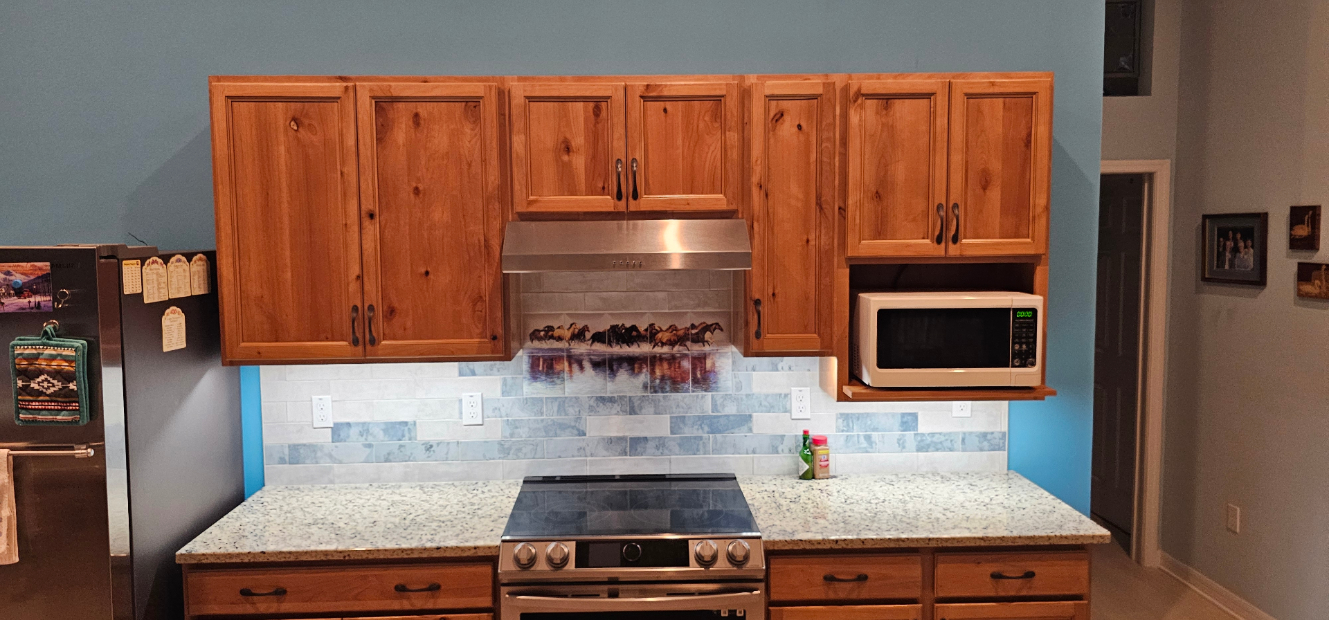 Kitchen range and hood with backsplash outlets installed to code
