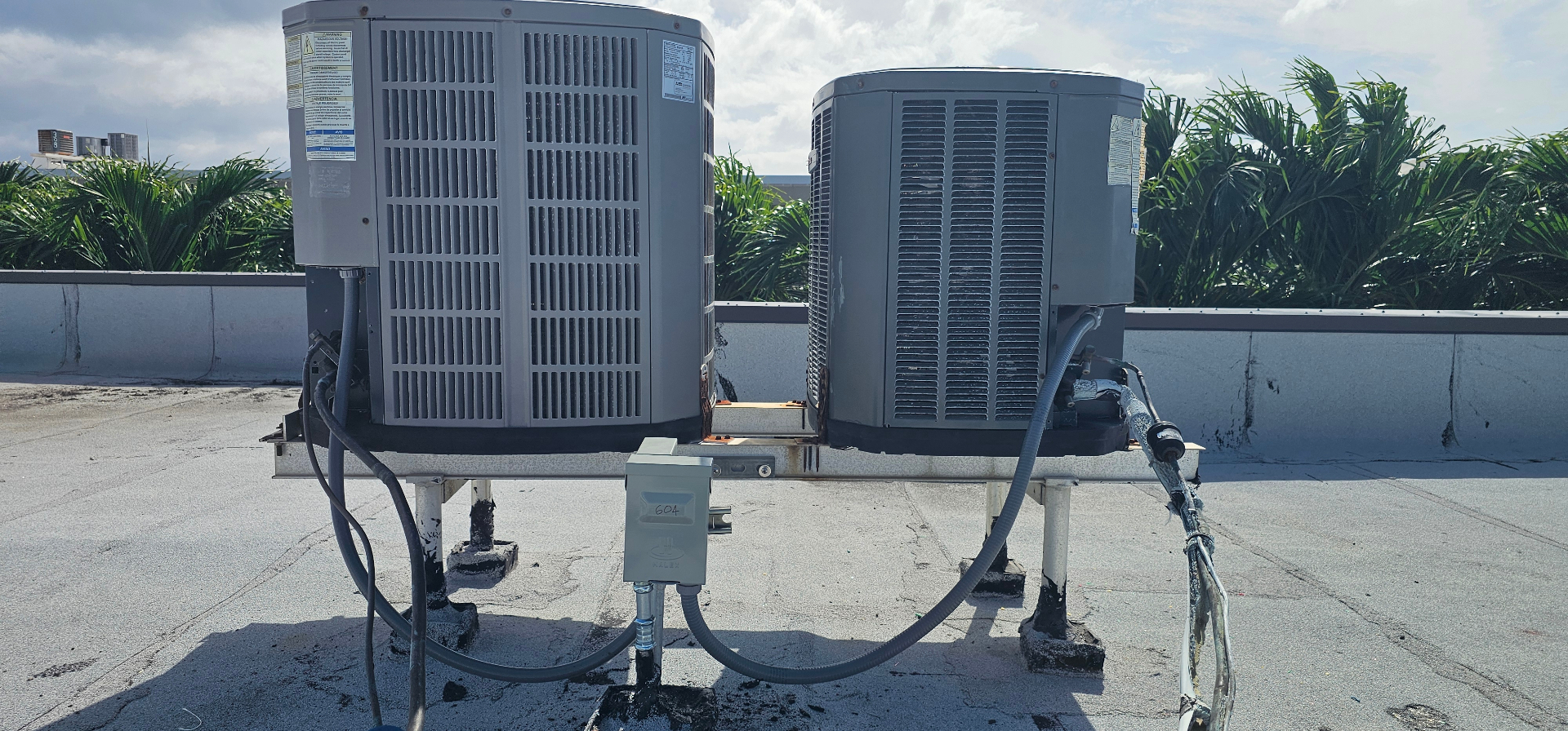 Rooftop HVAC disconnect and power installation on a commercial roof